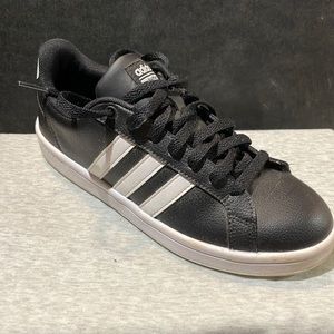 Adidas size 7 black with white stripes